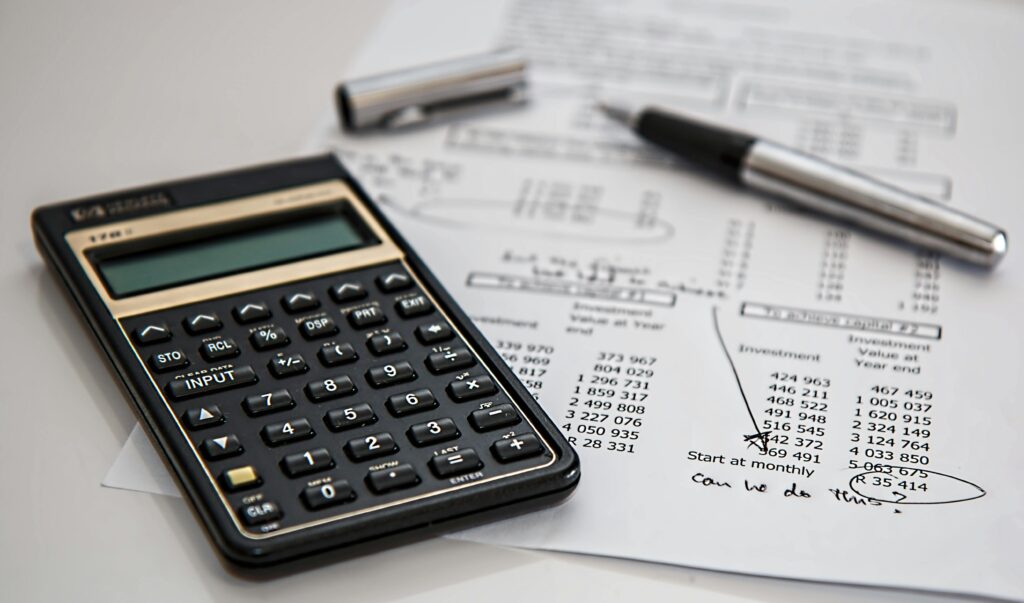 calculator calculation insurance finance 53621 53621 3 Close-up of financial documents with calculator and pen, ideal for business management themes.